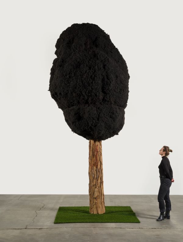 Henry Taylor – From sugar to shit. : TAYLH118075-hires Henry Taylor One tree per family  2023 Mixed media  457.2 x 152.4 x 121.9 cm / 180 x 60 x 48 in  Photo: Jeff McLane © Henry Taylor  Courtesy the artist and Hauser & Wirth 